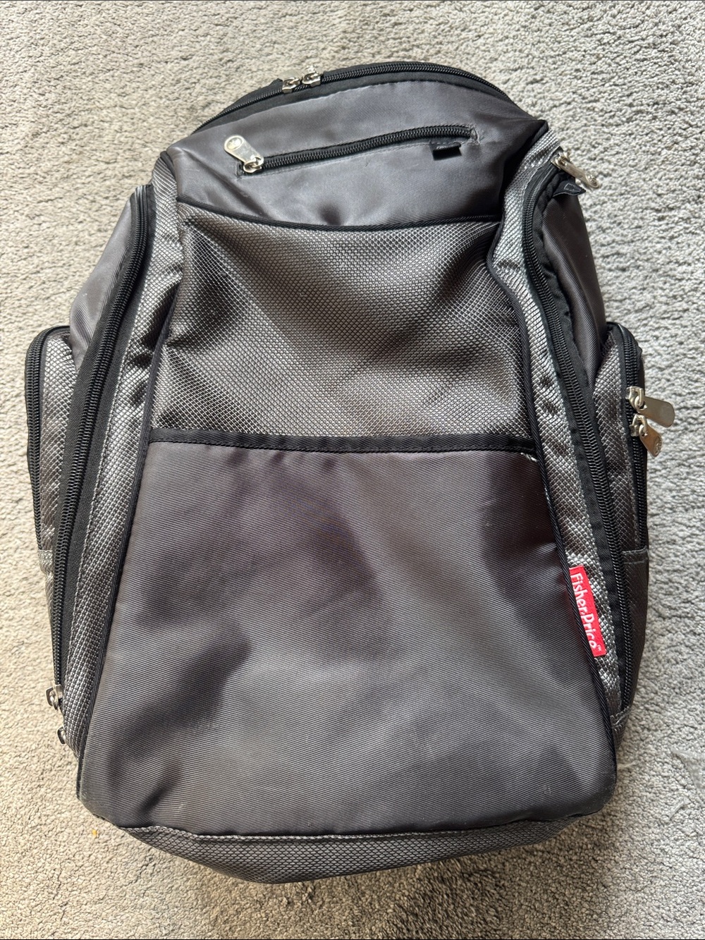Fisher-Price Black and Gray Everyday Baby Backpack with wipe pocket.